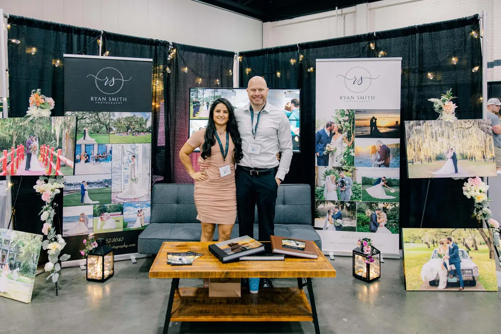 Ryan and his wife Lizeth at the Ryan Smith Photography booth at a Myrtle Beach bridal show